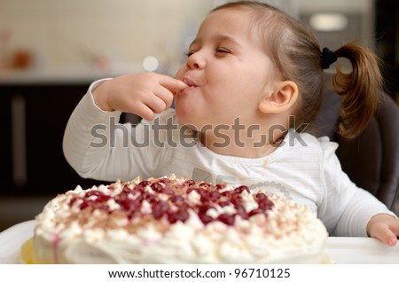 Stockphoto on Cute Little Girl Eating Cake Stock Photo 96710125   Shutterstock