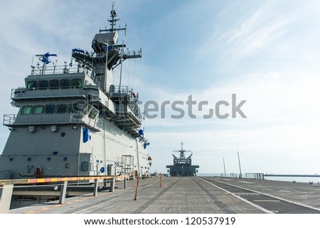 Large battle ship in Naval base, taken on a sunny day