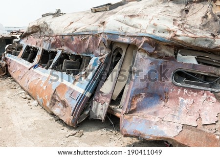 A wreckage of passenger train from train yard on a sunny day