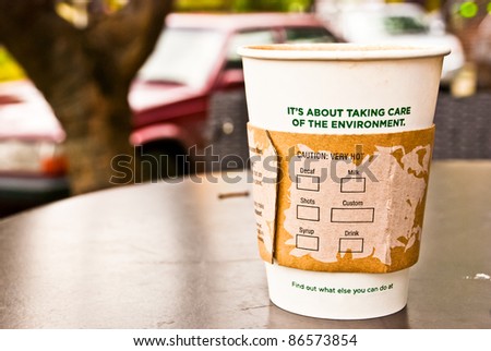 a cup of hot coffee in paper cup for the environment, no visible trademarks