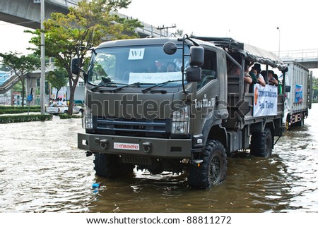 BANGKOK - NOVEMBER 7 : Large Royal Thai army truck carried flood victims after impact with heaviest flood and rain in 20 years in the capital on November 07, 2011 in Bangkok, Thailand.