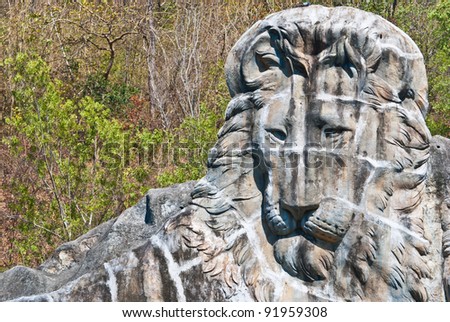 Large lion stone sculpture, taken on sunny afternoon