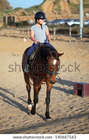 Little jockey and horse