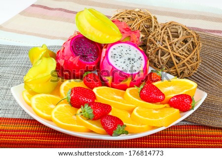 Exotic Fruit Dish with Dragon Fruit, pitahaya,strawberries and orange slices