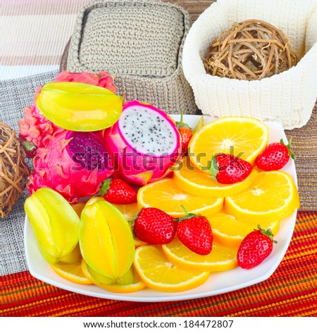 Exotic Fruit Dish with Dragon Fruit, pitahaya,strawberries and orange slices