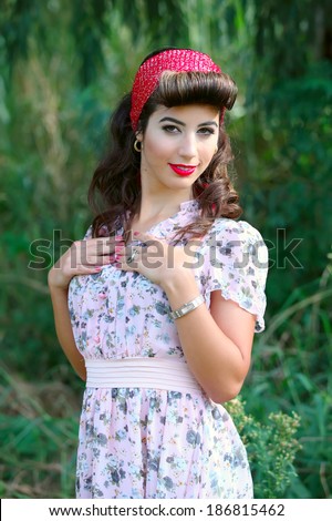 young woman with pin-up make-up and hairstyle