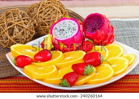 Exotic Fruit Dish with Dragon Fruit, pitahaya,strawberri es and orange slices
