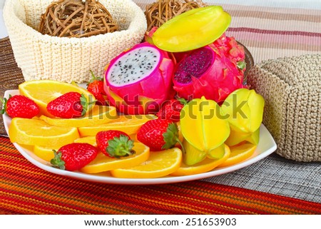 Exotic Fruit Dish with Dragon Fruit, pitahaya,strawberri es and orange slices