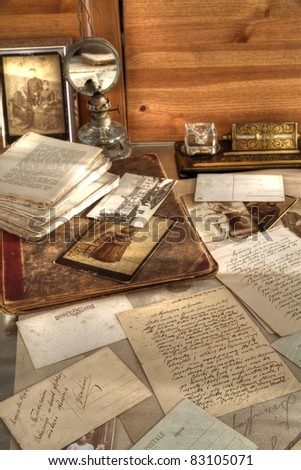 Closeup of old photos,books and correspondence.