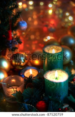Christmas decoration with candle lights,baubles an twinkle lights  on background.