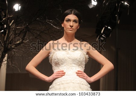 THESSALONIKI, GREECE - JANUARY 15: A model wears a wedding dress during the Expo Wedding Fair 2012 fashion show on January 15, 2012 in Thessaloniki, Greece. The fashion show took place at Velidion Conference Center.