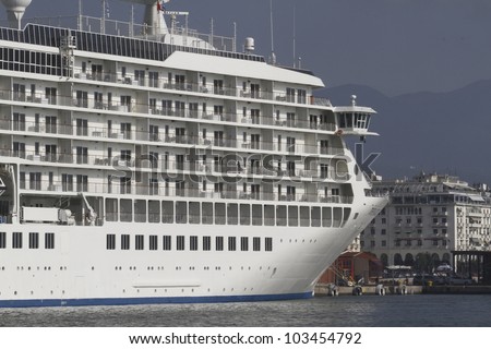 White cruise ship anchored in port