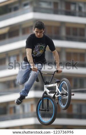 THESSALONIKI,GREECE-APRIL 29:Unidentified  bmx rider jumps during a performance during the  Thessaloniki  Street Party for European Youth Capital- Candidate City on April 29,2011