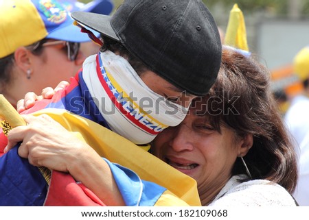 CARACAS, VENEZUELA - MARCH 16, 2014: Venezuelans protest in the street against the government for human rights violations and killings of civilians in peaceful demonstrations
