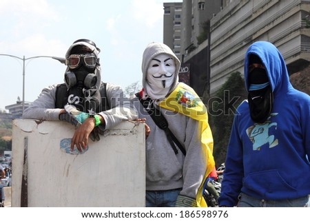 CARACAS, VENEZUELA - APRIL 10, 2014: Venezuelans protest in the street against the government for human rights violations and killings of civilians in peaceful demonstrations