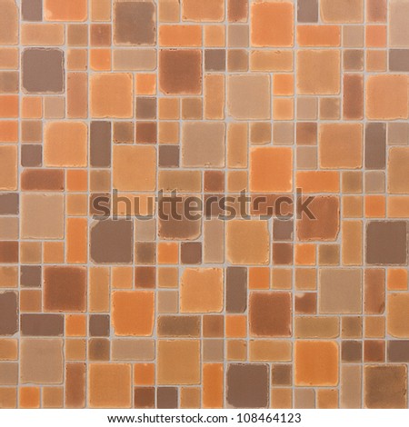 Fragment of tile with orange and beige squares