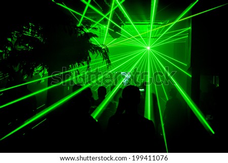 Green bright lasers at nightclub party rave