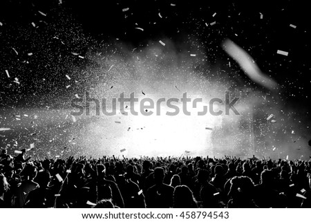 Black and White Confetti Silhouette Crowd at a Music Festival - Backlit.