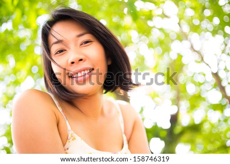Beautiful young healthy happy woman in nature