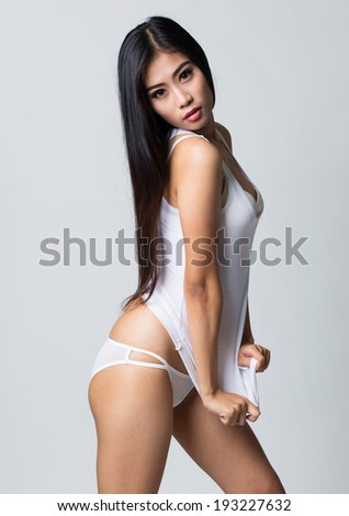 Beauty asian woman wearing white shirt and white lingerie