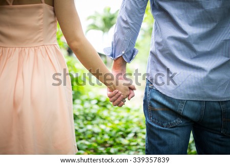 Happy love  couple holding hands in the morning at outdoor