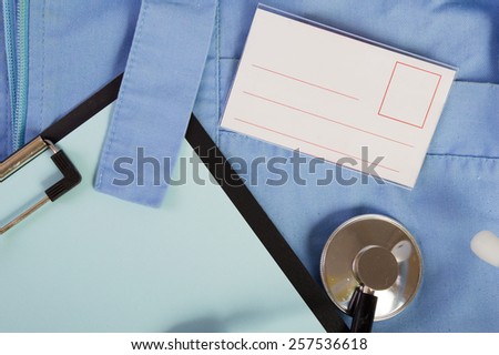 stethoscope medical gown and a folder