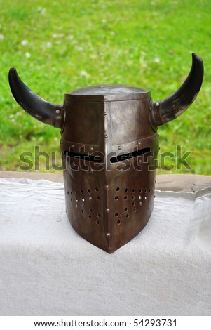 A medieval knight helmet with horns