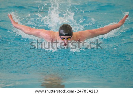GRAZ, AUSTRIA - APRIL 05, 2014: Stefan Wurzer (Austria) places 4th in the men\'s 200m butterfly event in an indoor swimming meeting.