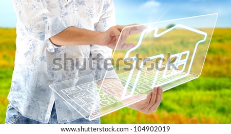 The man drawing house on laptop LCD display