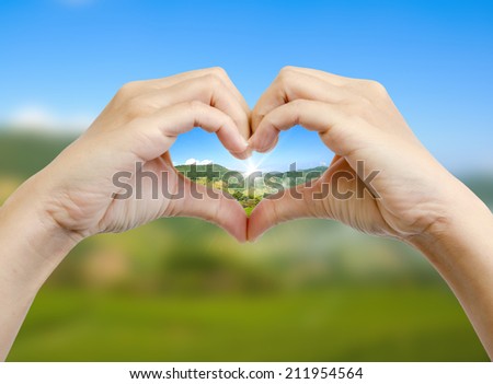 green world in the heart hand concept