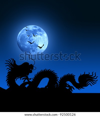 Dragon over the roof with blue moon