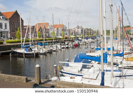 Yachts docked in the old picturesque Dutch historical port in Brouwershaven, Zeeland