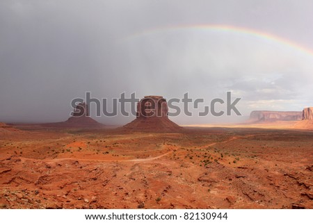 Rainbow at Edge of Storm Over Monument Valley - Arizona, United States
