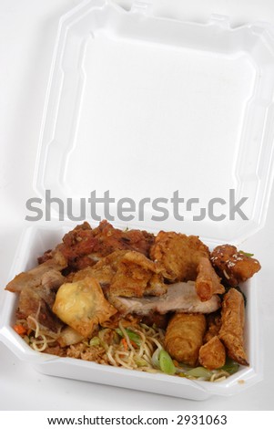 Chinese Buffet food loaded in a to go container with egg roll, noodles, rice, chicken and beef.