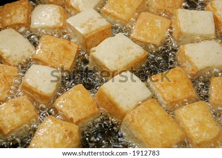 cutting tofu in boiling oil
