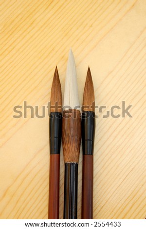 three chinese brushes