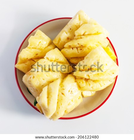 Pineapple chunks isolated on white