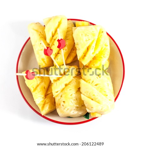 Pineapple chunks isolated on white