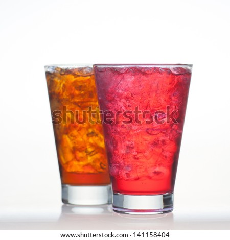 Red fruit and root beer flavor soft drinks whit soda water isolated on white background