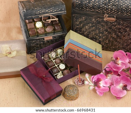 Beautiful chocolate gift set box on brown cloth background