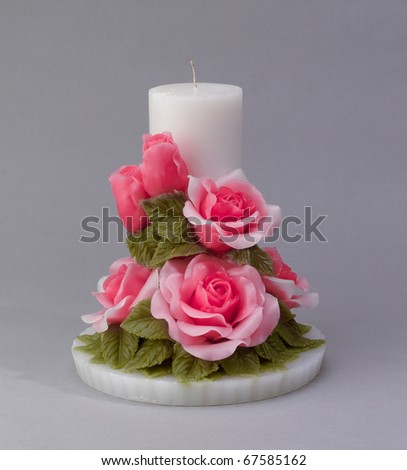 A nice handicraft rose candle the home decoration item isolated