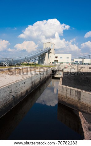 The water in the concrete canal flowing to waste water systems for cleaning before draining to the sea