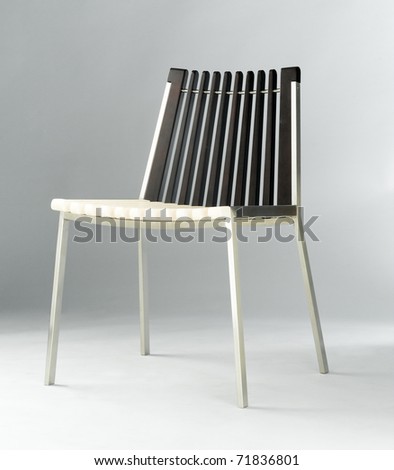 Wooden and metallic material chair isolated on grey background