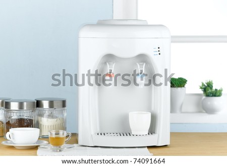 Hot and cool water maker machine in the kitchen interior