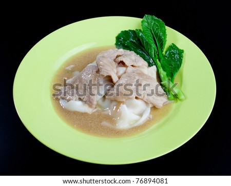Noodle with sliced pork and kale leaf  with seasoning gravy the traditional Thai style food