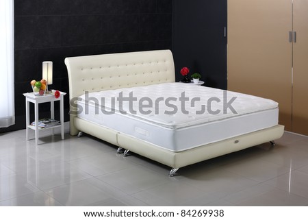 Luxury mattress and bedding set in an interior bedroom