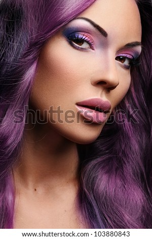 Portrait of beautiful woman in purple hair