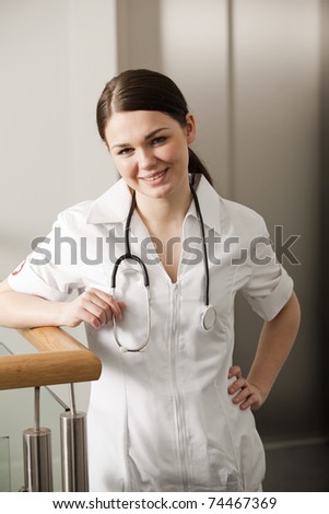 Young doctor standing in hospital hall