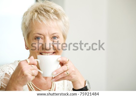 Elderly woman with cofee
