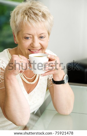 Elderly woman with cofee